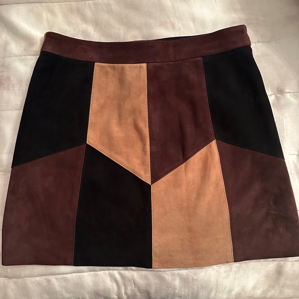 Chic Lamb Leather Mini Skirt in Black, Brown, and Tan.